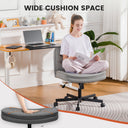 Wide cushion space ergonomic office chair in a bright home office setting with a laptop and plants, highlighting comfort and adjustable features.