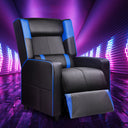 Black and blue ergonomic recliner chair with plush cushioning and extended footrest, showcased in a vibrant purple neon-lit room, ideal for office and game settings.