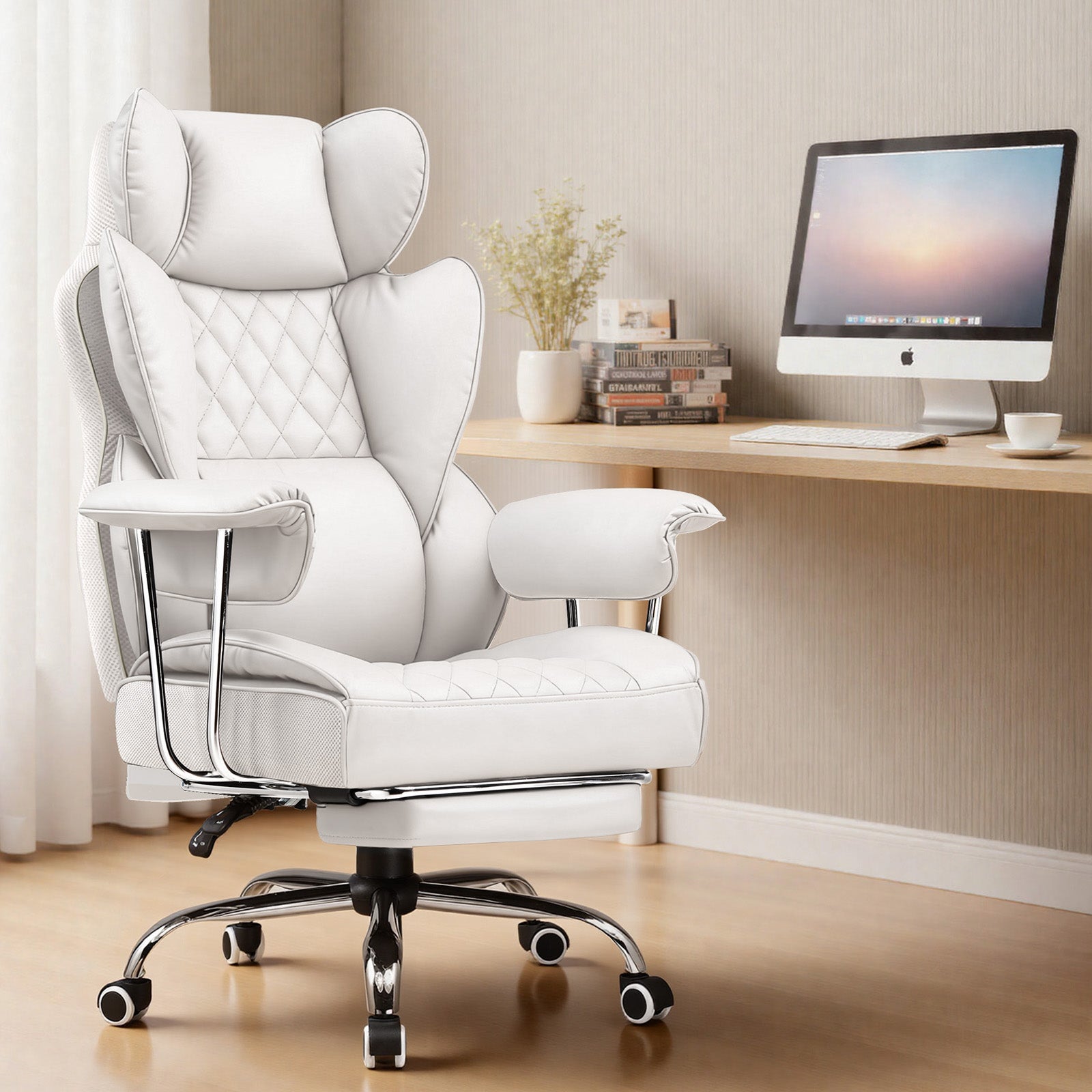 White chair in home office with computer.