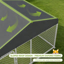 Close-up of an outdoor dog kennel with a sloped roof design made of premium Oxford fabric, showing arrows indicating water runoff to prevent rain and snow buildup in a garden setting.
