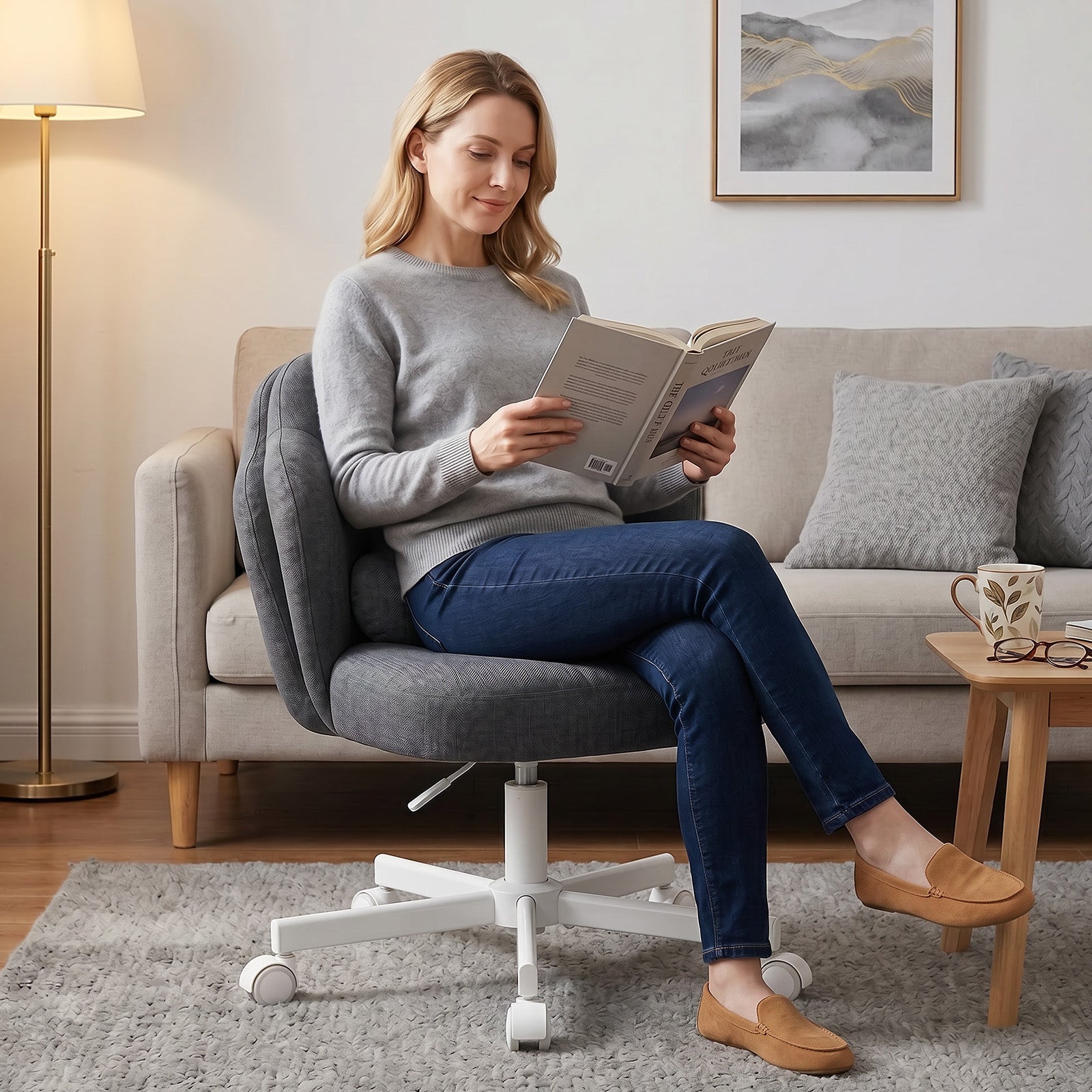 Woman sitting on a height-adjustable chair with a petal-shaped backrest and wheels, reading a book in a modern living room featuring a floor lamp and wooden coffee table with a mug and glasses, part of New Arrivals, All Products, and Office & Game collections.