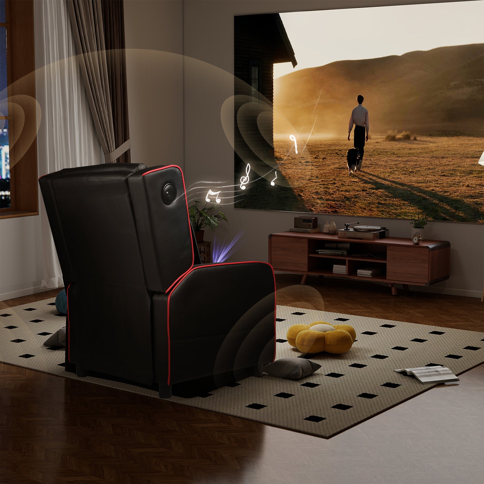 Black recliner chair with red piping in a modern living room, facing a large screen showing a person walking a dog, surrounded by musical notes indicating built-in Bluetooth speakers, part of an office furniture and recliner chair collection.