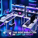 A modern gaming setup with multiple white desks, computers, keyboards, shelves, and neon purple and blue lighting in a dark room. Text at the bottom says 'THE SIDE SHELF CAN BE LEFT OR RIGHT' with arrows indicating adjustability.