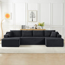 Dark grey compressible U-shaped sectional sofa with corduroy fabric in a minimalist living room setting, featuring wall art, wooden cabinet, and a floor lamp.